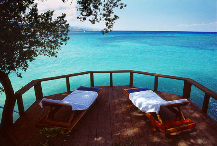 Along a private cove with 700 feet of soft sand, lawns and flowering shrubs, the Jamaica Inn, in Jamaica offers spacious suites featuring lanais that function as outdoor living rooms.